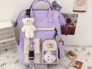 กระเป๋านักเรียนระดับกลางของผู้หญิง สีม่วง กระเป๋าเป้ Ins สไตล์เกาหลีความจุขนาด ใหญ่ลำลองสำหรับนักเรียน