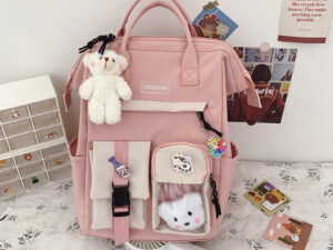 กระเป๋านักเรียนระดับกลางของผู้หญิง สีชมพู กระเป๋าเป้ Ins สไตล์เกาหลีความจุขนาด ใหญ่ลำลองสำหรับนักเรียน